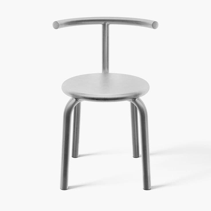 A minimalist gray metallic stool with a round seat and a simple, curved backrest. The frame and legs are constructed from tubular metal, presenting a clean, industrial aesthetic. The finish appears matte or satin, providing a modern touch. — 3D model