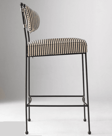 A contemporary bar stool featuring a slender black metal frame and striped upholstered seat and backrest. The design includes an integrated footrest and ball-tipped feet. — 3D model