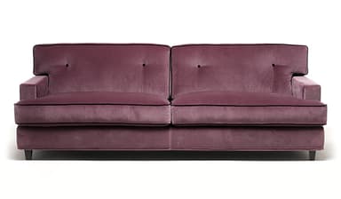 A close-up view of a sofa section, showcasing plush velvet upholstery in a dusty rose color. The sofa features a tufted back cushion with a black button accent and decorative black piping along the edges of the headrest and armrest. The material appears soft and textured, indicative of velvet. — 3D model