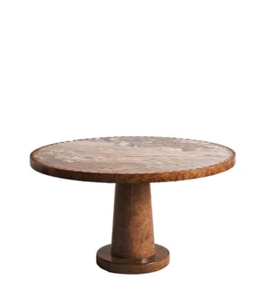 A close-up view of a table section, showcasing a round top with a decorative, scalloped edge. The tabletop features a complex pattern of swirling natural stone, incorporating shades of beige, pink, grey, and brown. The base, visible at the bottom, is made of wood and has a curved, layered design. — 3D model