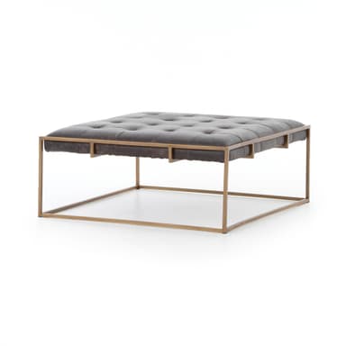 A square tufted ottoman with a dark brown leather top and a thin metal frame. The frame has a brushed brass or gold finish and forms a minimalist base with intersecting support beams. The leather upholstery features deep button tufting. — 3D model