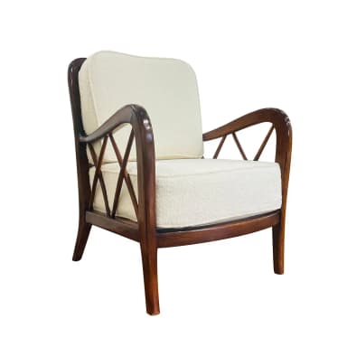 A wooden armchair with a dark stained finish and upholstered seat and back cushions. The armrests have a curved silhouette, and the back features a geometric lattice pattern created by intersecting wooden slats. The legs are slender and tapered. — 3D model