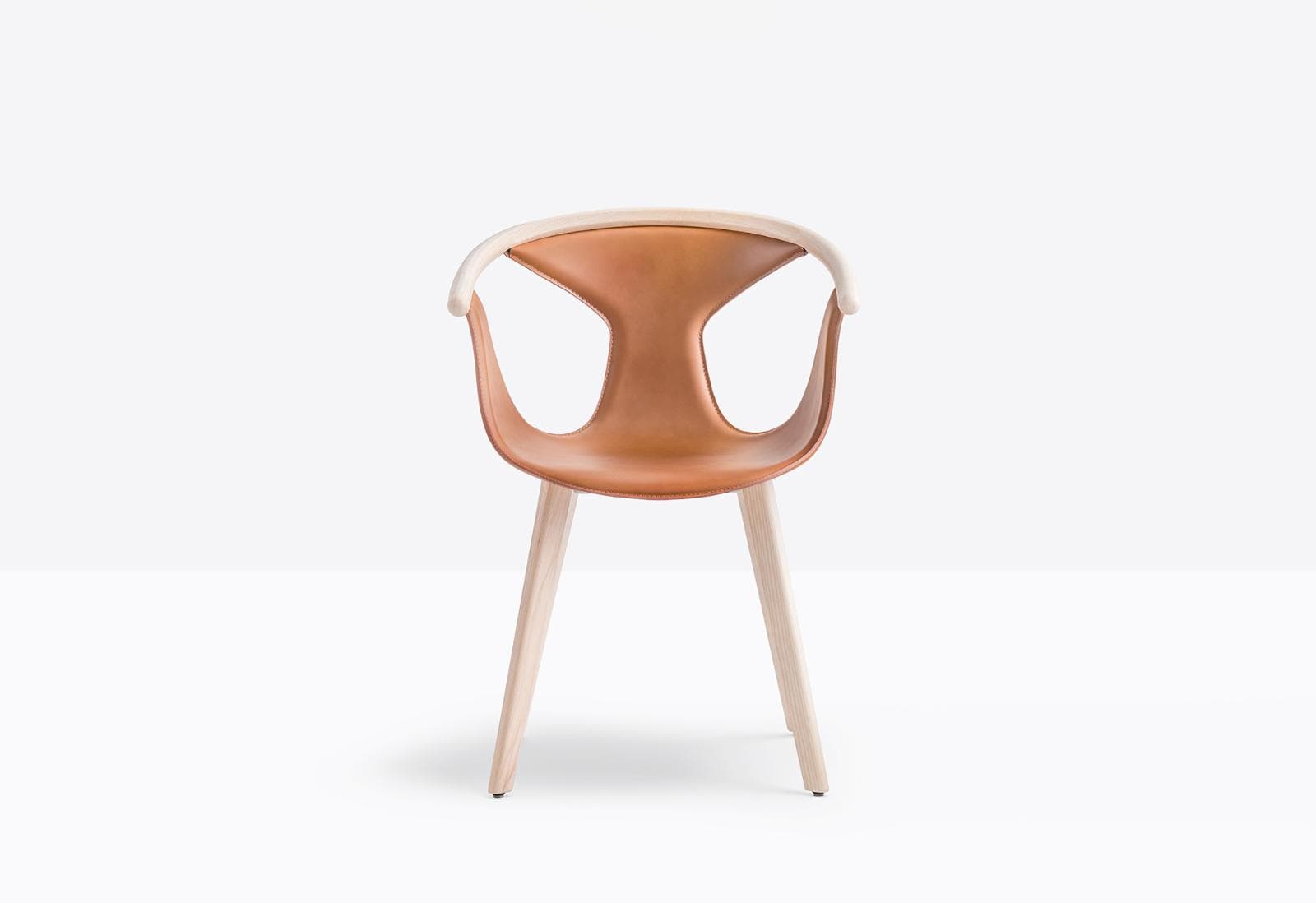 A modern armchair with a light wood frame and a tan leather seat and backrest. The backrest has a distinctive curved shape with cutouts. The seat is sculpted for comfort. The chair has four tapered wooden legs. — 3D model