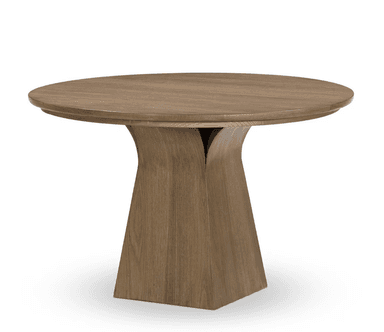 A round dining table with a pedestal base. The tabletop is circular and appears to have a slight lip or edge detail. The base is a single, solid column that flares outwards towards the bottom, forming a stable pedestal. The entire piece is constructed from wood with a visible grain pattern. — 3D model