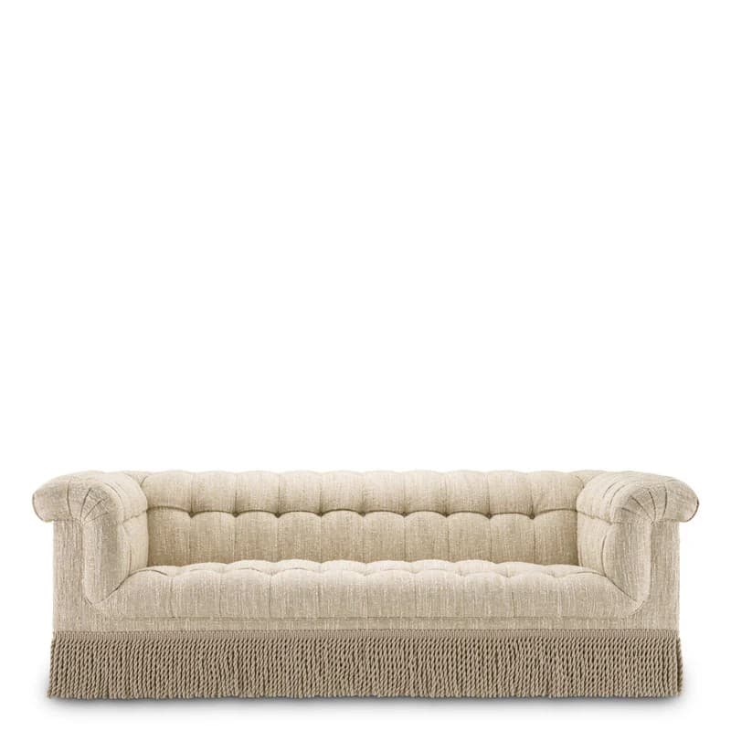 A three-seater sofa with a tufted back and seat, rolled arms, and a decorative fringe along the bottom skirt. The upholstery appears to be a textured, light-colored fabric. — 3D model