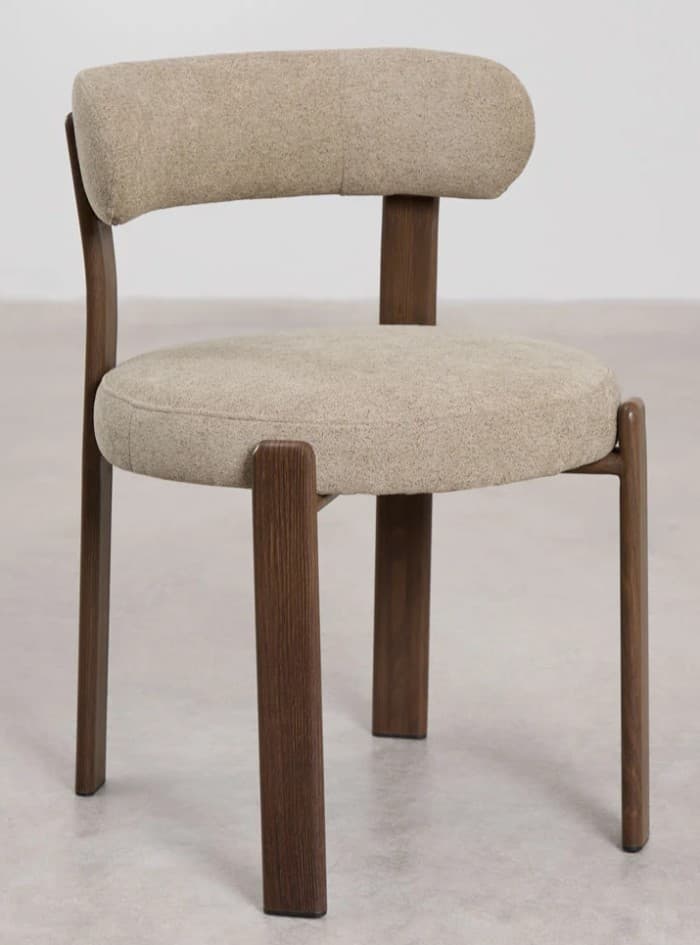 A modern dining chair with a rounded upholstered seat and backrest supported by a dark wood frame. The frame features four legs, with the rear legs extending upwards to support the backrest, and a horizontal back support connecting them. The upholstery appears to be a textured fabric in a neutral tone. — 3D model