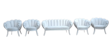 An elegant, upholstered loveseat featuring a distinctive shell-back design with vertical channel tufting. It has integrated armrests, nailhead trim along the base and outer arms, and is supported by four short, curved legs. The upholstery is a light, possibly white, color. — 3D model