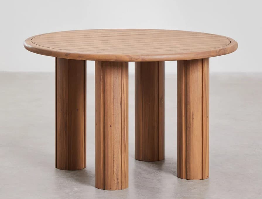 A round wooden coffee table with four thick, cylindrical legs. The tabletop has a slatted surface and a rounded edge. The legs are textured with vertical grooves. The design appears to be modern or contemporary, possibly intended for outdoor use due to the material. — 3D model