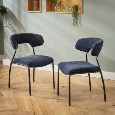 An armless chair featuring a dark blue upholstered seat and a separate, curved backrest, supported by a slender black metal frame with four legs. — 3D model