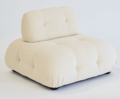 An off-white, deeply tufted, armless modular lounge chair upholstered in a boucle fabric. It features a low-profile design with a separate, equally tufted backrest cushion that appears to rest against the main base. The overall form is soft and rounded, indicative of comfort-focused design. — 3D model