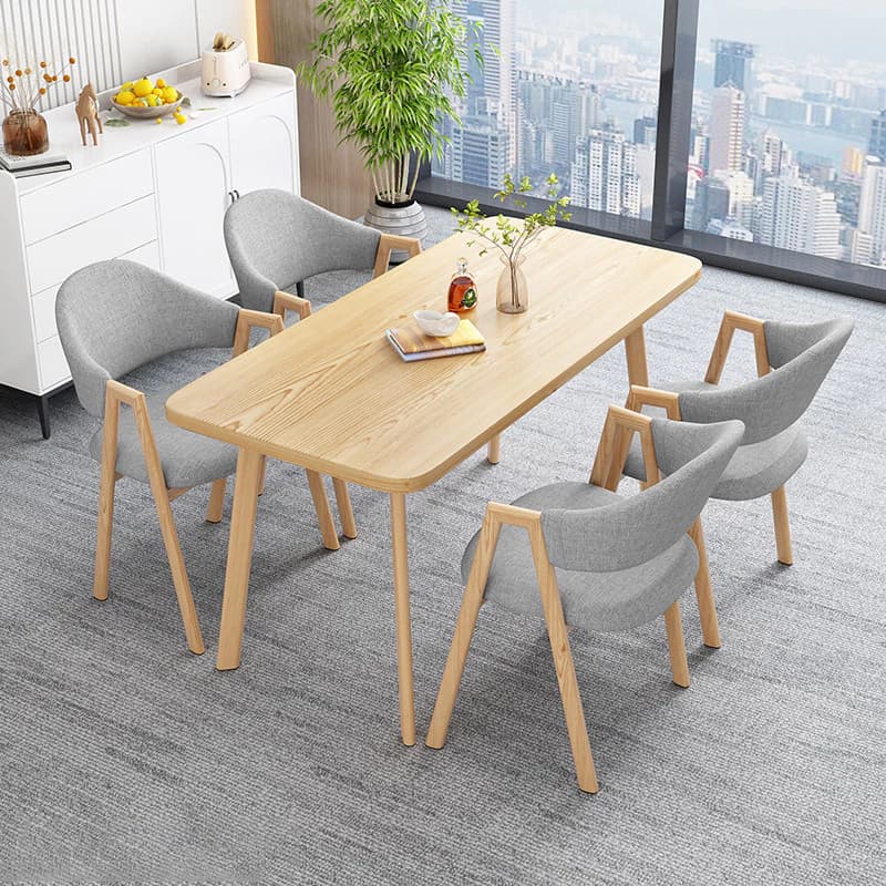 A rectangular wooden coffee table with rounded corners and four slender, tapered wooden legs, presented against a clean white background. — 3D model