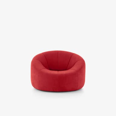 A low-profile, single-person lounge chair upholstered in red fabric, featuring a deep, curved seat and back with panel stitching, and an integrated base. — 3D model