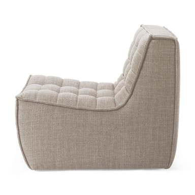 A low-profile, modular lounge chair element upholstered in a light beige textured fabric, featuring tufted back and seat cushions, designed for relaxed seating. — 3D model