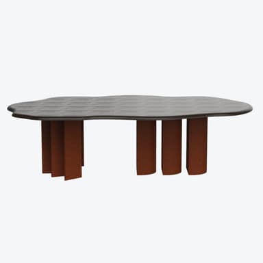 A coffee table with an organically shaped, irregular top and a base composed of multiple cylindrical legs. The tabletop has a dark, textured surface, possibly wood grain or a stone composite, with a smooth, rounded edge. The legs are a uniform rust-orange color and have a matte, possibly cork or textured composite finish. — 3D model