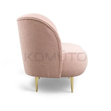 A modern sofa with a rounded back and seat, upholstered in a textured boucle fabric. It is supported by four slender, angled metal legs. — 3D model