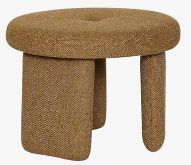 A small, round, fabric upholstered ottoman featuring a single button tuft on its top surface. It is supported by three short, thick, and rounded legs, all covered in a textured, woven brownish-gold fabric. — 3D model
