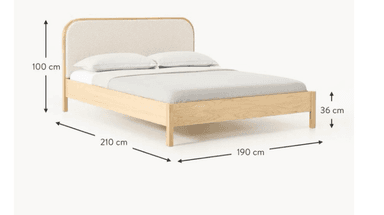 A modern platform bed featuring a dark wood frame and a cane-webbed headboard with rounded corners, complete with bedding. — 3D model