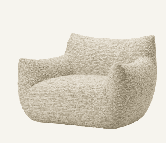 A single, fully upholstered lounge chair with a rounded, organic form, covered in a textured light-colored boucle fabric. The chair features integrated armrests and no visible legs. — 3D model
