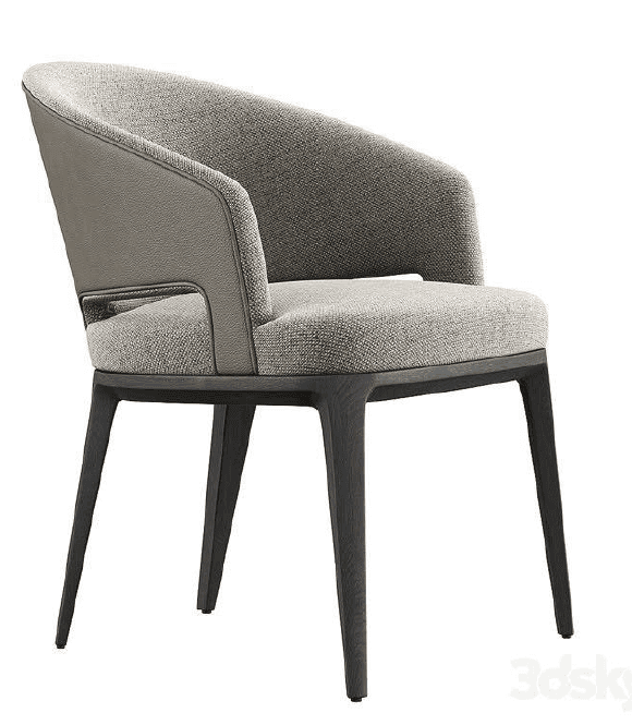 A modern armchair with a upholstered seat, back, and arms, featuring a curved backrest and distinct external leather panels on the sides of the backrest. The chair has a dark wooden frame and four tapered legs. — 3D model