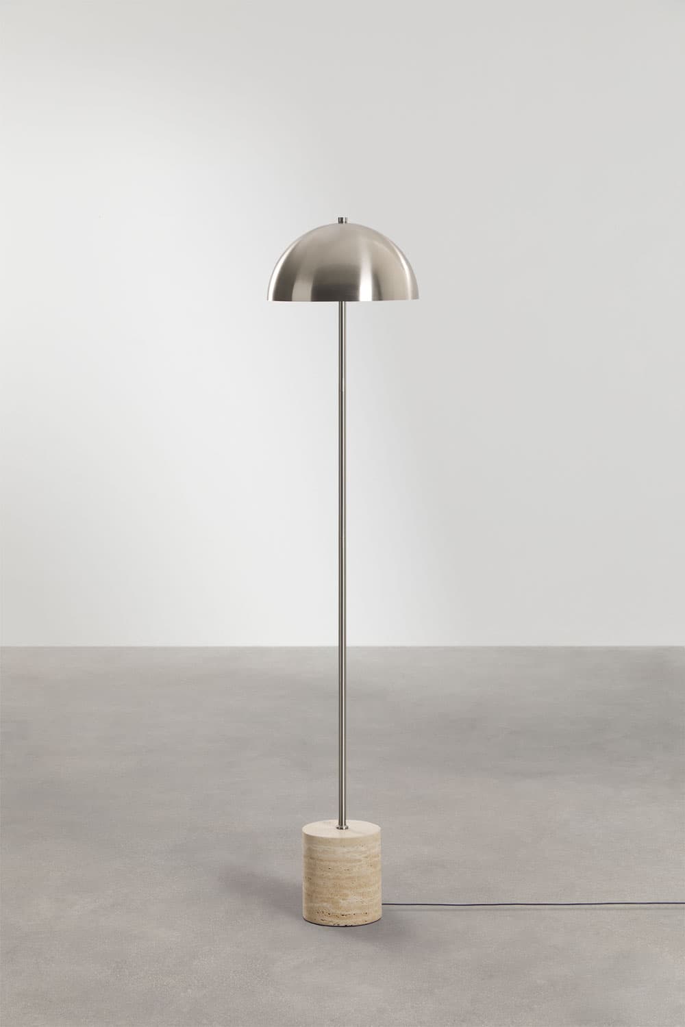 A modern floor lamp featuring a polished or brushed metal dome shade, a slender metal stem, and a cylindrical travertine stone base. The design is minimalist and sleek, combining natural stone texture with reflective metal surfaces. — 3D model
