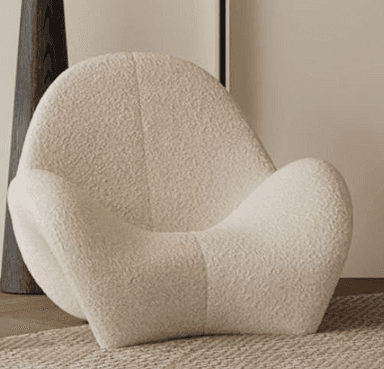 A contemporary lounge chair with a fluid, sculptural form, fully upholstered in an off-white bouclé fabric. The chair features a continuous, curvilinear silhouette that integrates the seat, backrest, and base into a single, organic shape, designed for comfort and aesthetic appeal. — 3D model