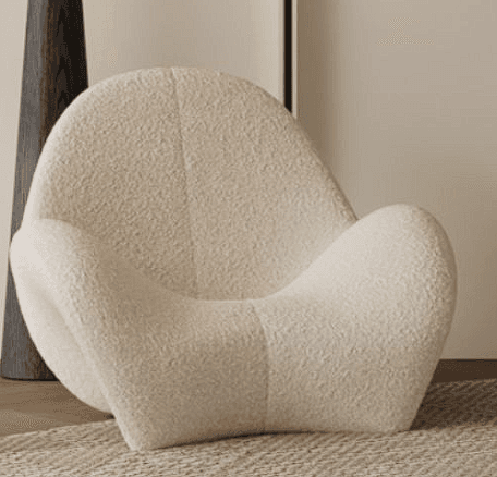 A contemporary lounge chair with a fluid, sculptural form, fully upholstered in an off-white bouclé fabric. The chair features a continuous, curvilinear silhouette that integrates the seat, backrest, and base into a single, organic shape, designed for comfort and aesthetic appeal. — 3D model