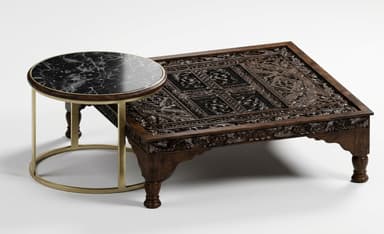 A square, low-profile coffee table crafted from dark wood, featuring extensive, intricate hand-carved details across its entire top surface and side aprons. The table is supported by four short, turned legs. — 3D model