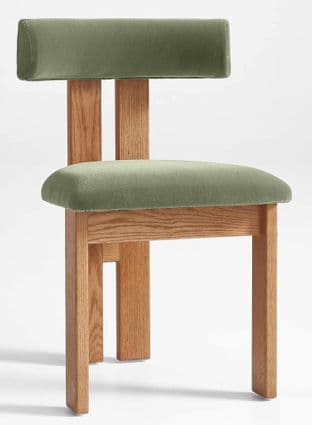 An armless chair featuring a solid wood frame and upholstered seat and backrest. The frame is made of light-toned wood with a natural finish, characterized by blocky, straight legs and a minimalist construction. The seat and the low, wide backrest are both padded and covered in a sage green velvet or similar soft, short-pile fabric. — 3D model