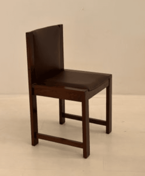 A wooden chair with upholstered seat and backrest. The chair features a rectangular seat and a tall, rectangular backrest. The frame is constructed from dark wood with clean lines, suggesting a modern or minimalist design. The legs are square and straightforward, connected by stretchers for stability. The upholstery is a dark, solid color. — 3D model