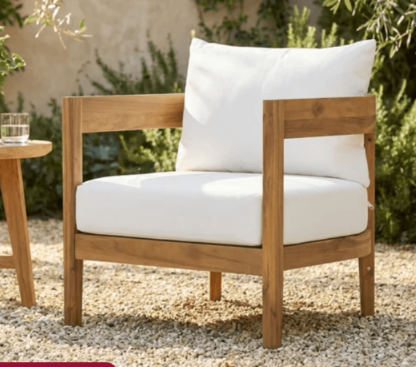A modern lounge chair featuring a sturdy, rectilinear wooden frame and thick, white upholstered cushions for both the seat and back. — 3D model