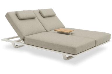 A contemporary dual chaise lounge featuring two independently adjustable backrests, each with a small head pillow. It is supported by a sleek white metal frame and upholstered in a light greige textured outdoor fabric. — 3D model