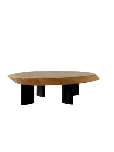 A low-profile coffee table featuring an irregularly shaped, organic wooden top with a darker, recessed central panel. The table is supported by four short, stout, black-colored legs, giving it a minimalist yet distinctive appearance. — 3D model