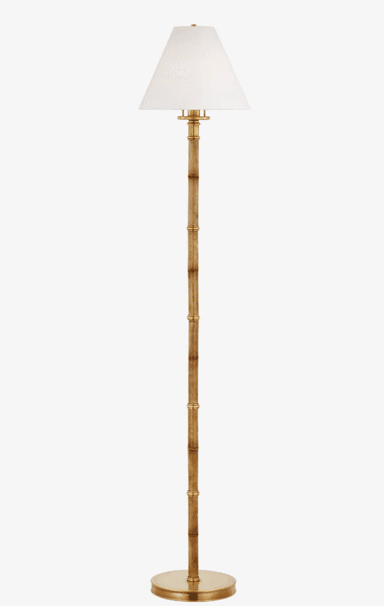 A tall floor lamp featuring a slender, textured stalk designed to mimic bamboo, with polished brass accents and a circular base. It is topped with a classic white fabric empire shade. — 3D model