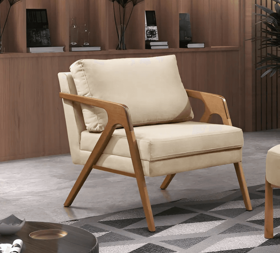 A modern armchair featuring a light-colored upholstered seat and back cushions, supported by an exposed wooden frame with integrated armrests and tapered legs. — 3D model
