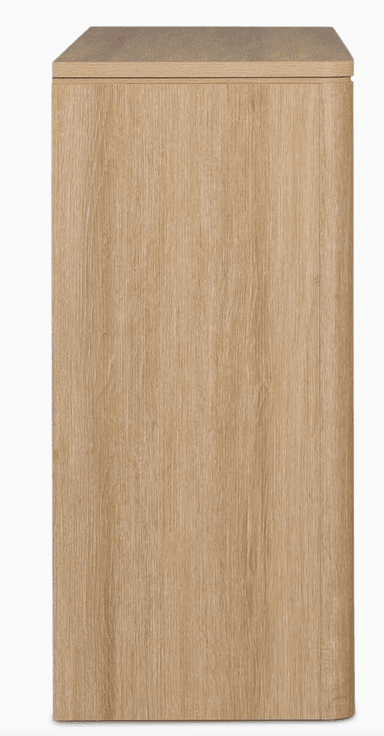 A dresser with six drawers arranged in two columns of three. The dresser has a light wood grain finish and rounded edges on the sides and the top surface. It appears to be a freestanding unit. — 3D model