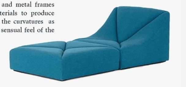 A modern chaise lounge featuring a segmented, geometric design upholstered in a textured teal blue fabric. The piece consists of a long, low-profile seat area and an integrated, upward-curving backrest. The segmentation creates distinct cushioned panels across both the seat and back, giving it a sculptural appearance. — 3D model