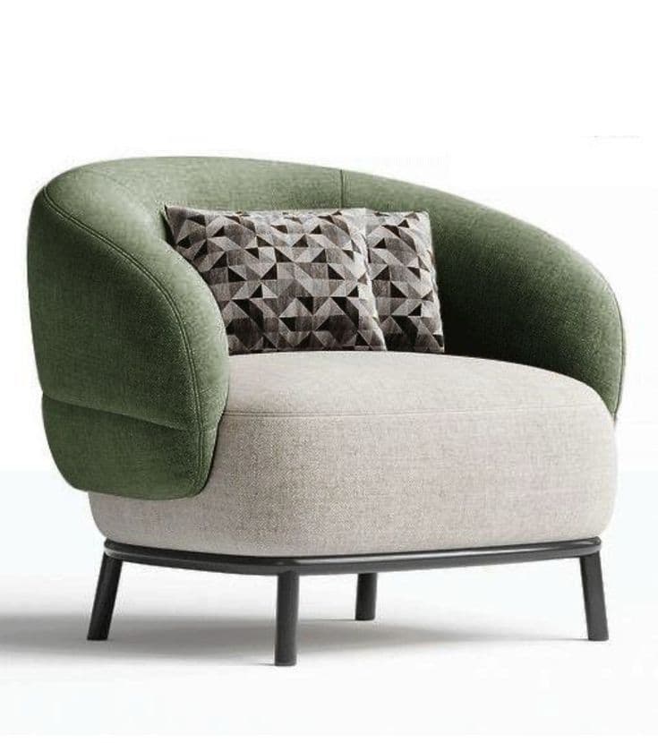 A contemporary armchair featuring a rounded, enveloping silhouette with two-tone fabric upholstery. The outer back and arms are upholstered in a textured green fabric, while the inner seat cushion and front of the armrests are in a lighter, smooth grey. The chair is supported by a black-finished metal frame that forms the base and legs. Two small throw pillows with a geometric pattern rest against the backrest. — 3D model