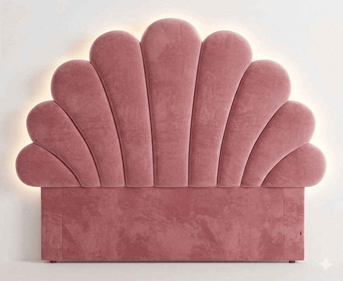 A pink velvet headboard with a scalloped, fan-like design. The edges of the fan shapes are illuminated with a soft light. The headboard has a rectangular base with padded, vertical tufting. — 3D model