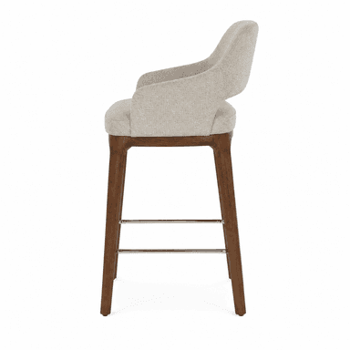 A modern bar stool with a upholstered seat and backrest, supported by wooden legs and a metal footrest. — 3D model