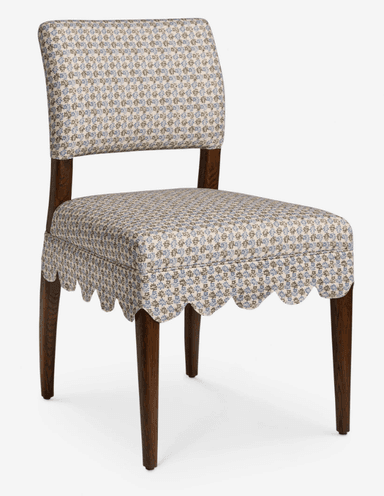 A traditional upholstered side chair featuring a scalloped fabric skirt and a small floral pattern. It has a fully upholstered seat and back, supported by dark wooden tapered legs. — 3D model