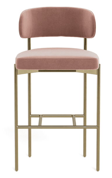 A modern bar stool featuring a rounded upholstered backrest and a padded seat cushion, both covered in a dusty rose velvet fabric. The frame is constructed from slender, tubular metal with a golden or brass finish, incorporating an integrated rectangular footrest. The design is sleek and minimalist, suitable for contemporary interiors. — 3D model