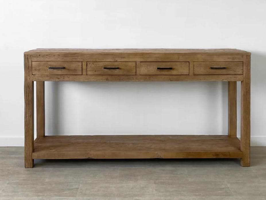 A rectangular console table with a weathered wood finish, featuring four drawers across the top and a lower shelf. The legs are thick and substantial, with a visible grain pattern. The drawer pulls are simple, dark metal bars. — 3D model