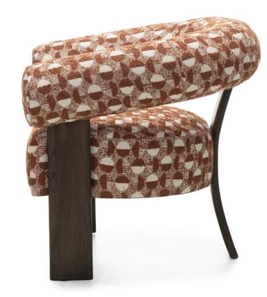 A contemporary armchair featuring a curved, padded backrest that extends into armrests. The seat is also padded and supported by four dark wooden legs. The upholstery displays a geometric pattern in brown and white. — 3D model