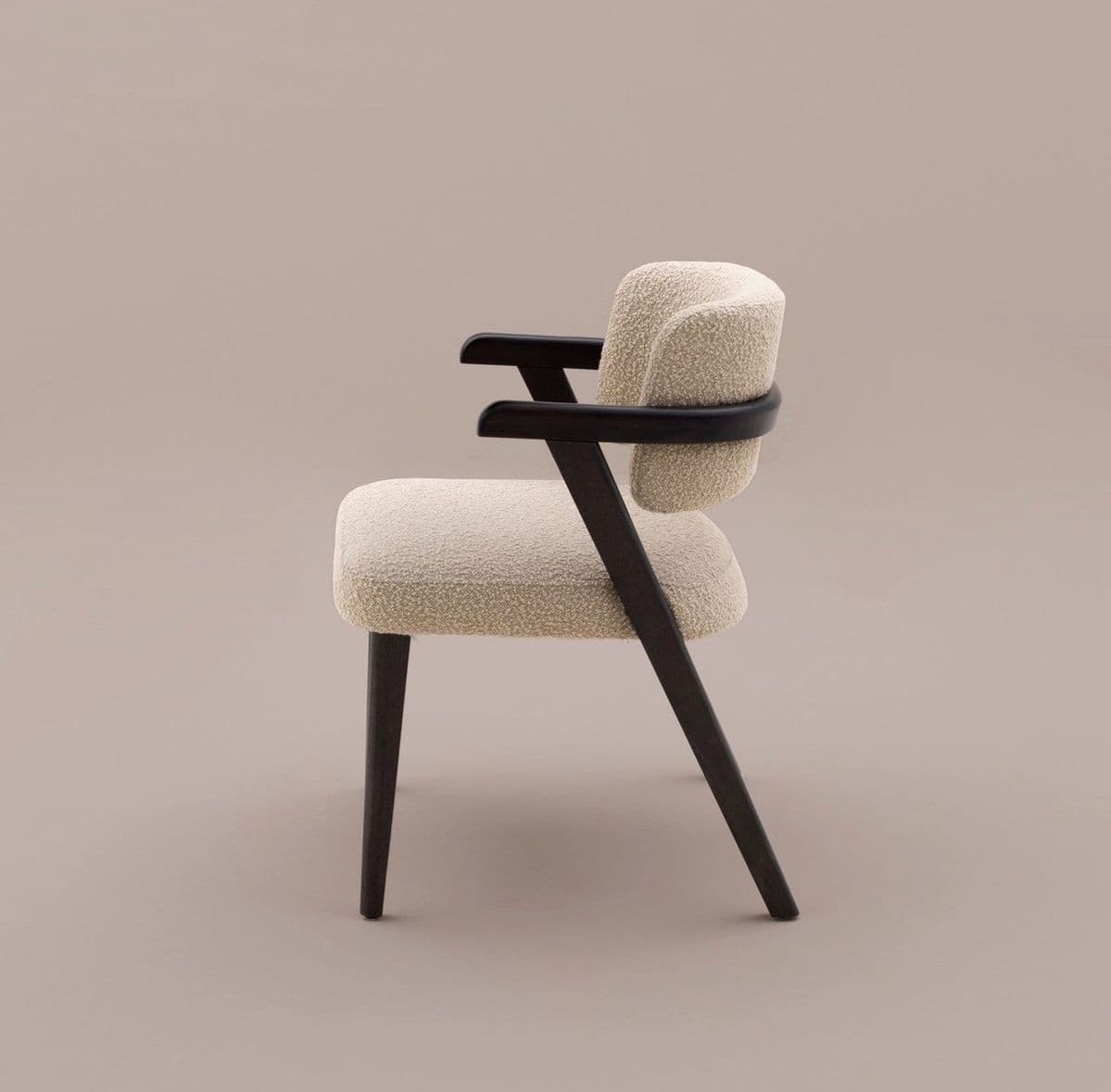 A contemporary armchair featuring a light, textured boucle upholstery on the seat and curved backrest, supported by a dark-stained wooden frame with integrated armrests and tapered legs. — 3D model