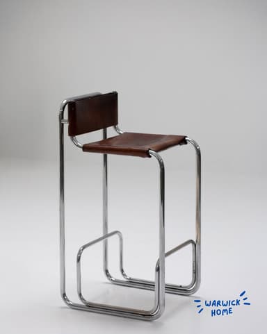 A high-seated bar stool featuring a continuous frame constructed from bent tubular chrome and a seat and backrest upholstered in brown leather, exhibiting a minimalist, modernist aesthetic. — 3D model