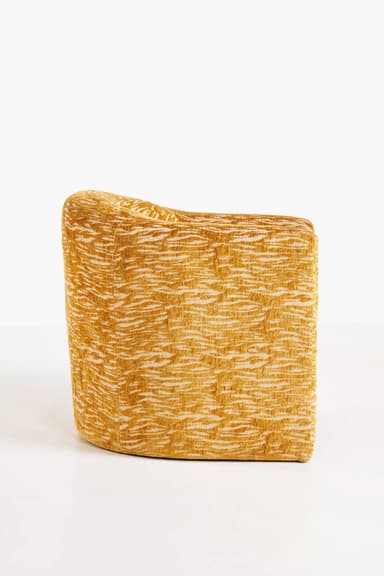 A standalone armchair with a rounded back and seat. The upholstery features a textured pattern in shades of yellow and cream, resembling an abstract animal print or natural fibers. — 3D model