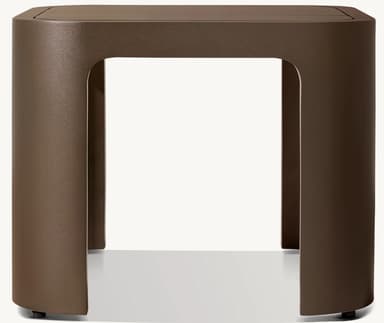 A contemporary side table with a square top and four rounded, hollow legs. The structure features smooth, continuous curves and a matte metallic finish. The legs are set inwards from the edges of the tabletop, creating an open, airy design. Small adjustable feet are visible at the base of each leg. — 3D model