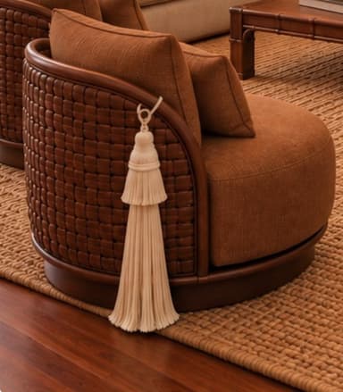 A barrel-back accent chair featuring a rounded wooden frame with dark brown woven exterior paneling, and plush rust-orange fabric upholstery for the seat and back cushions. A decorative cream-colored tassel hangs from the side. — 3D model