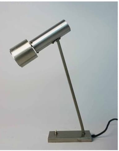 A minimalist silver-colored desk lamp featuring a rectangular base, a slender angled arm, and a cylindrical light head. A small toggle switch is located on the base. — 3D model