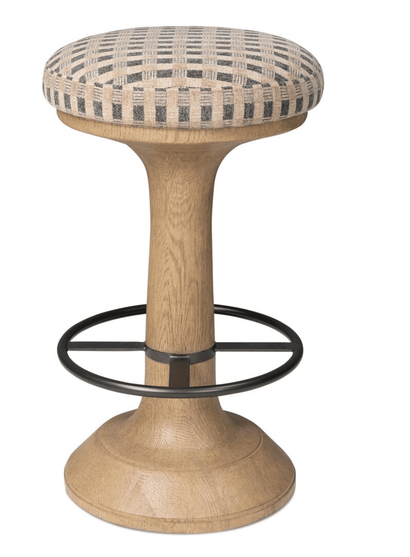 A modern bar stool featuring a round upholstered seat with a checkered pattern, supported by a flared wooden pedestal base with an integrated circular black metal footrest. — 3D model